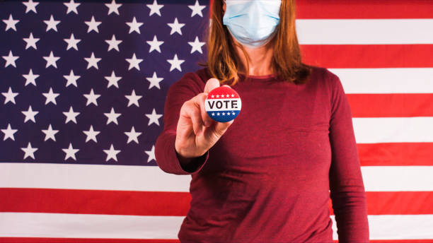 istock Voting woman with face mask 1281645977