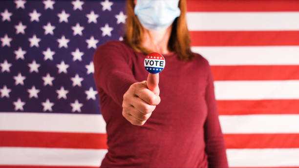 istock Woman showing elections sticker 1281645984