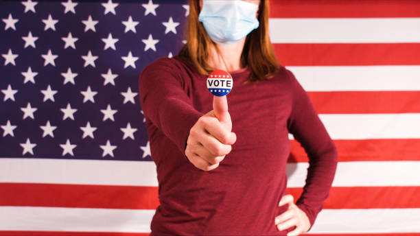 istock Woman showing elections sticker 1281645989
