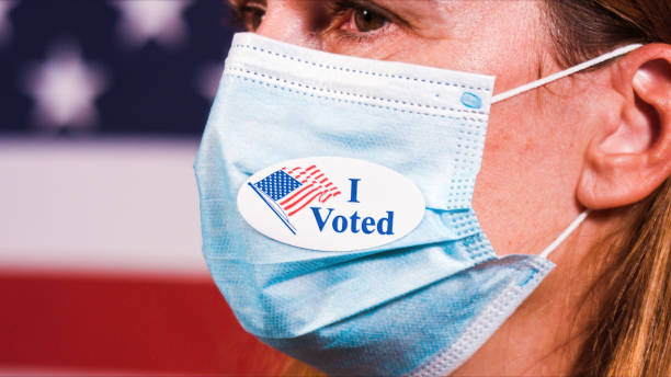 istock Woman with Voting sticker 1281645994