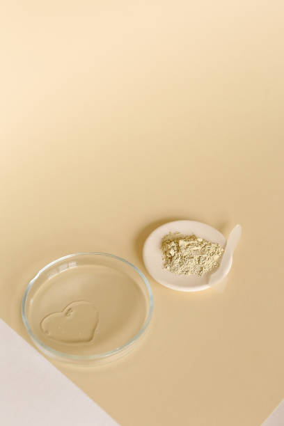 istock Clay powder and water in glass jar on light background with copy space 1281646665