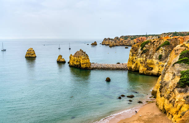 istock Coastal cliffs at Lagos - Algarve, Portugal 1281650301