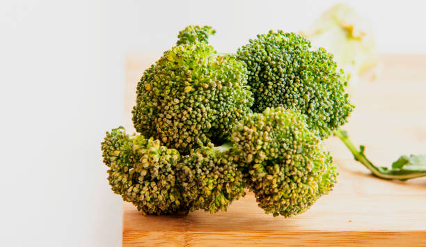 istock broccoli close up on wooden board 1281650511