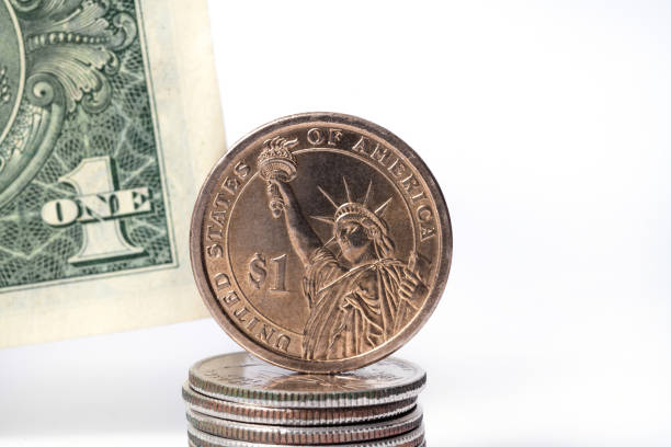 istock Metal dollar on paper dollar background 1281650690