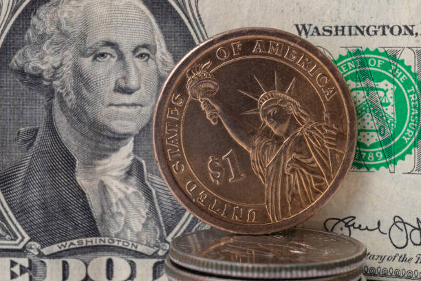 istock Metal dollar on paper dollar background 1281650692