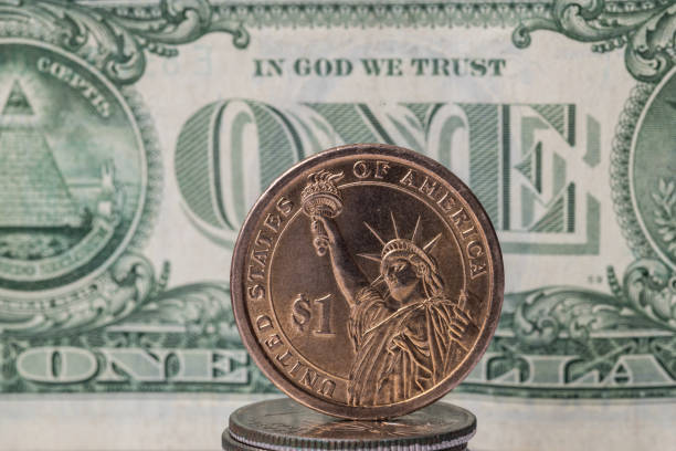 istock Metal dollar on paper dollar background 1281650805