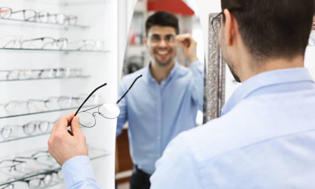 istock Over shoulder portrait of smiling young guy wearing spectacles 1281655833