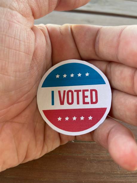 istock holding i voted badge detail shot 1281659477