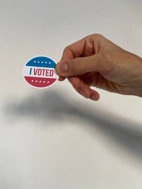 istock holding i voted badge detail shot 1281659485