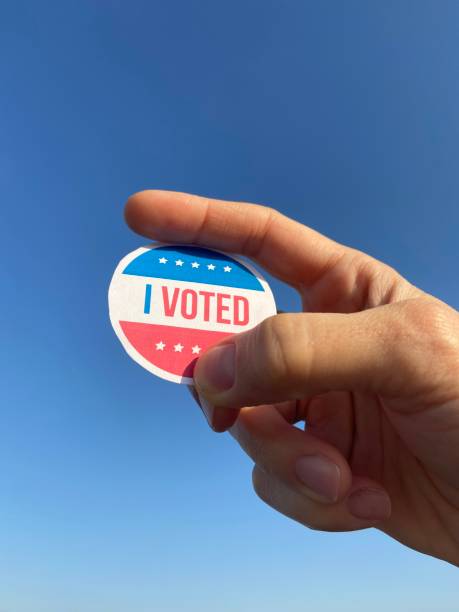 istock holding i voted badge detail shot 1281659490