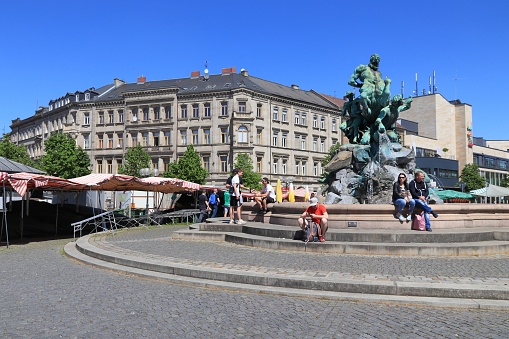 People visit Bahnhofsplatz (Station Square) in Furth, Germany. It is a major town in Middle Franconia, more than 1000 years old.
