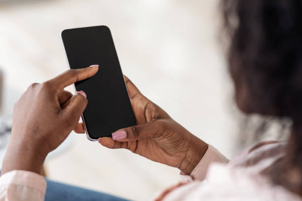 istock Unrecognizable African American Female Browsing Smartphone With Black Screen, Mockup Image 1281660020