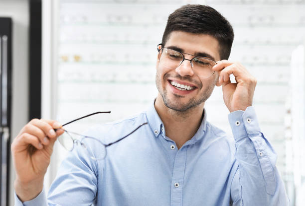 istock Portrait of handsome young man choosing spectacles 1281661280