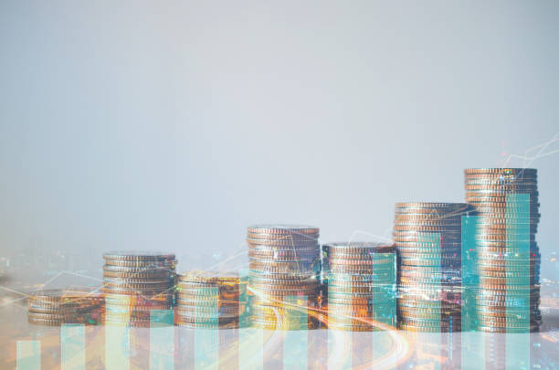 istock double exposure of city with row of coin stack with growth chart and graph progress report for business investment finance banking and money saving concept. 1281662851