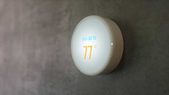 Learning Home Smart Thermostat On The Concrete Wall, 3d Rendering