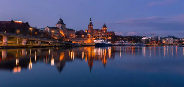 Szczecin. Historic city architecture. Night view on the river. Poland