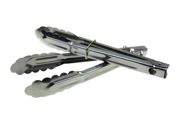 istock Stainless steel ice tongs isolated on white background. 1281664249