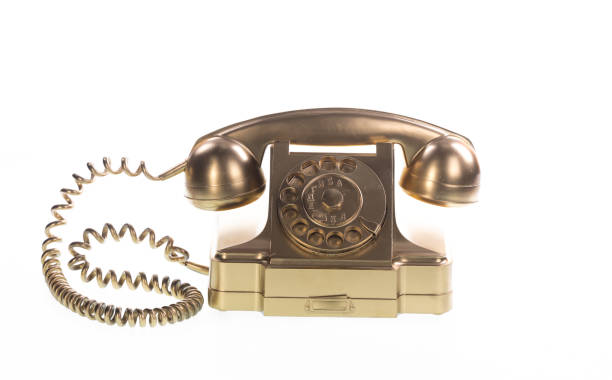 istock vintage gold telephone on white background 1281665919