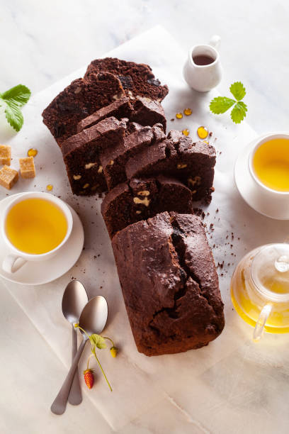 istock chocolate loaf cake with walnuts and prunes on the table with green tea. pause coffee 1281667483