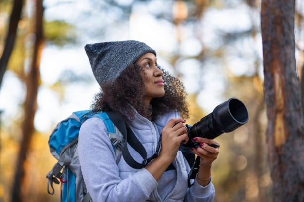 istock African American woman in the forest with a camera 1281668165