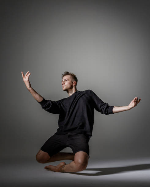 istock Modern Male Dancer on gray background 1281668888