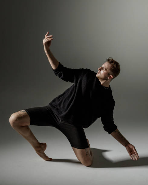 istock Modern Male Dancer on gray background 1281669031