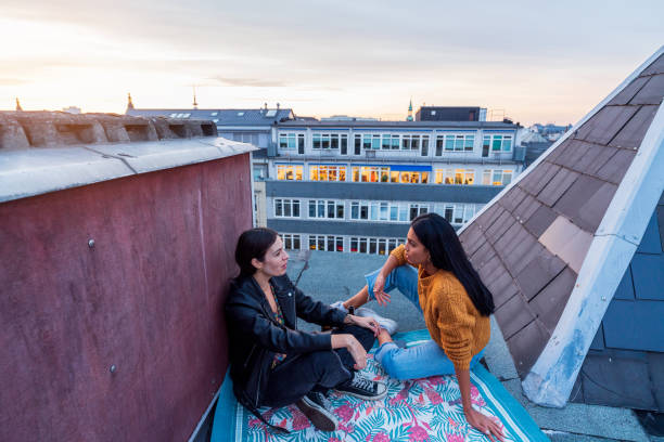 istock Gossip girls on a rooftop 1281669120