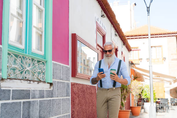 istock Senior man with a phone 1281669461