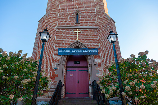 Frederick, MD, USA 10/13/2020: Founded in 1742, All Saints' is the oldest Episcopal parish in western Maryland. A Black Lives Matter banner hangs on top of its entrance door showing anti racist stance