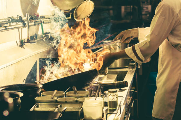 istock Chef stir fry busy cooking 1281671760