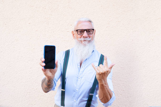 istock Senior man with a phone 1281671942