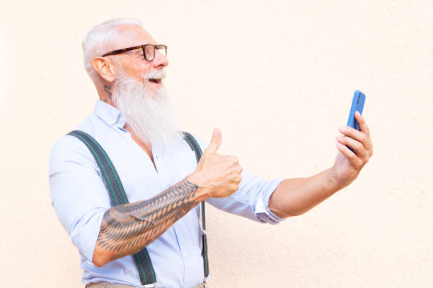 istock Senior man with a phone 1281671997