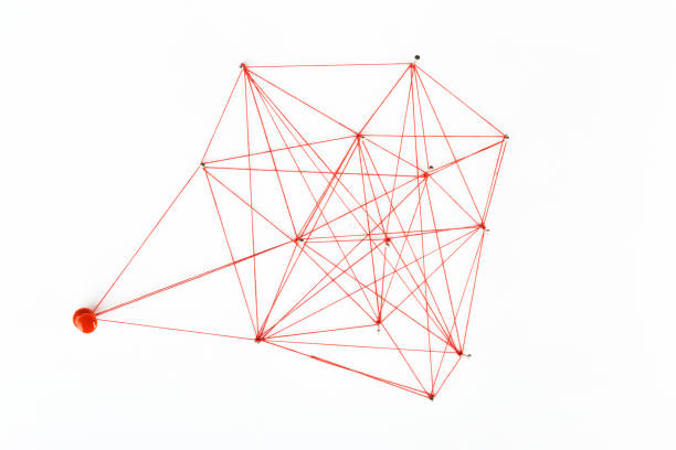 istock A large mesh of pins connected with a cord. Communication, network concept. Red 1281672050