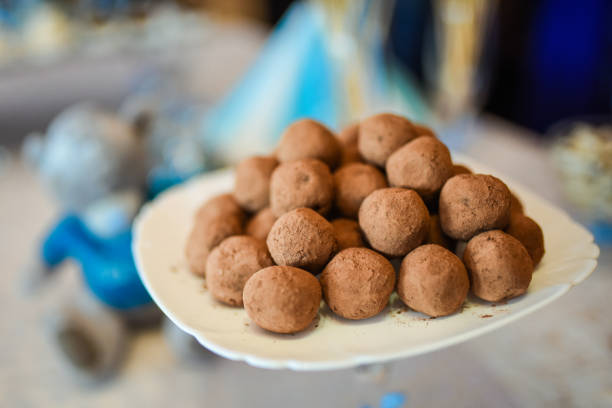 istock Sweet truffles on a plate covered with cocoa. 1281672679