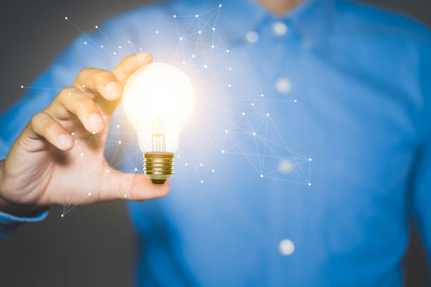 istock Businessman holding light bulbs, new ideas and Innovative idea concept. 1281672743