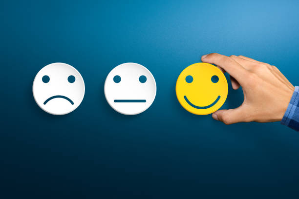 istock Customer service evaluation and satisfaction survey concepts. The client's hand picked the happy face smile. 1281672978