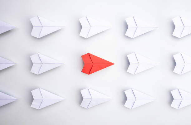 istock Group of paper planes in one direction and with one individual is different. innovative solution for business concept. 1281673186