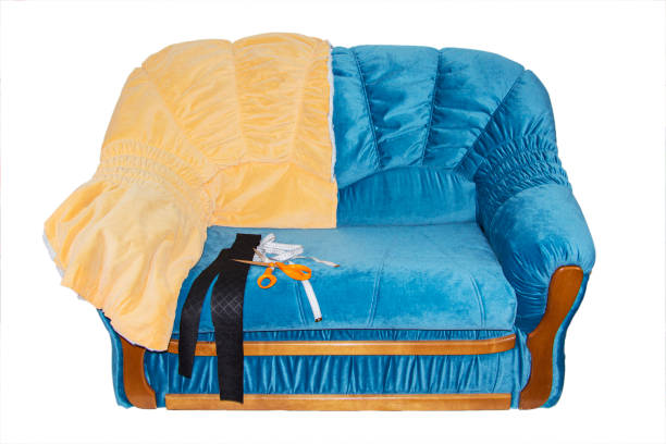 istock bright double sofa after renovation, isolated on a white background. Repair of upholstered furniture 1281673343