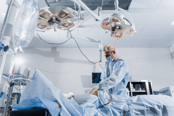 istock Abdominoplasty plastic operation to reduce the abdomen and remove cellulite. Correcting body shape. Surgeon does liposuction for patient in medical clinic 1281674183