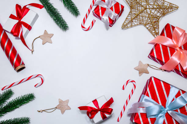istock Christmas Composition with Gift Boxes, Branches Fir Tree, Paper's Rools and Decorations on Light Background. 1281674664