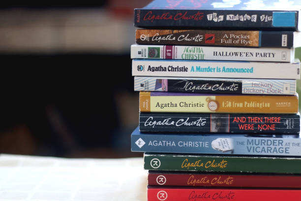 Agatha Christie's Books Split, Croatia - October 10, 2020: Stack of Agatha Christie's mystery books on the table. Selective focus. paperback photos stock pictures, royalty-free photos & images