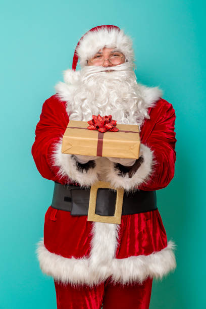 istock Santa offering Christmas presents 1281674984