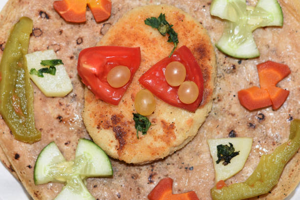 istock Asian Food Plate. Flat Bread, Burger, Fruit, Vegetables, Salad Serving 1281675817