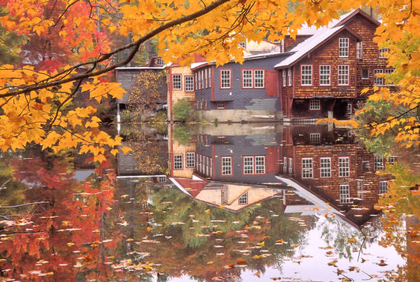 istock Reflection of Mill Building and Fall Foliage on Pond 1281679426
