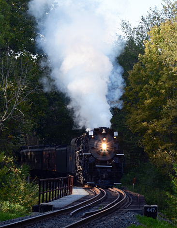 Steam Engine rounds the bend to cross a bridge over the Cuyahoga River in the Cuyahoga Valley National Park during its Fall run.