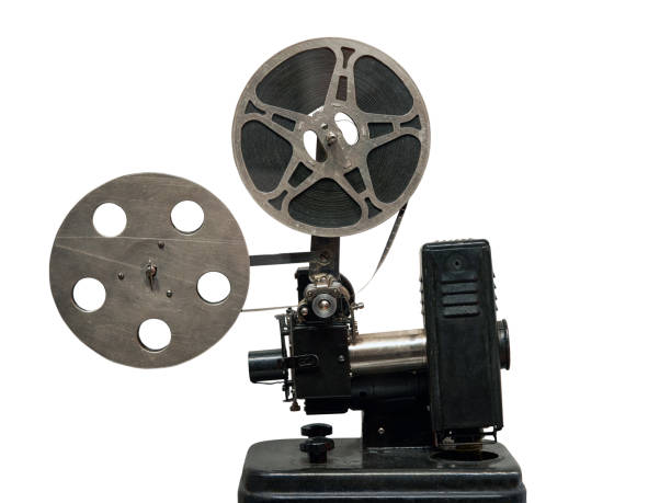 A closeup of a mid-20th century movie projector. A closeup of a mid-20th century movie projector. Isolated on white background. vintage movie projector stock pictures, royalty-free photos & images