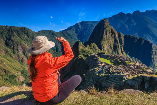 istock Female tourist looking at Machu Picchu 1281680593