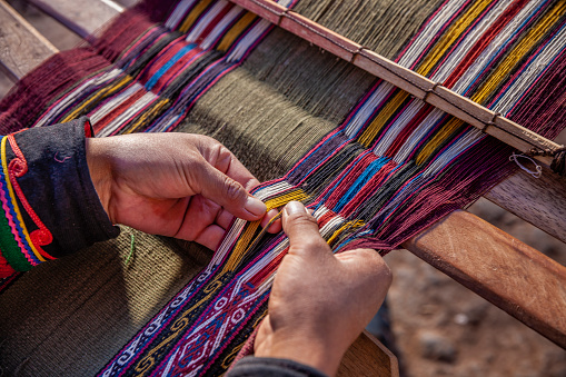 Peruvian woman weaving, The Sacred Valley, Chinchero photo
