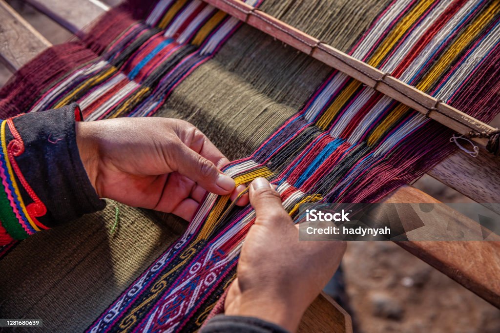 Peruvian woman weaving, The Sacred Valley, Chinchero The Sacred Valley of the Incas or Urubamba Valley is a valley in the Andes  of Peru, close to the Inca capital of Cusco and below the ancient sacred city of Machu Picchu. The valley is generally understood to include everything between Pisac  and Ollantaytambo, parallel to the Urubamba River, or Vilcanota River or Wilcamayu, as this Sacred river is called when passing through the valley. It is fed by numerous rivers which descend through adjoining valleys and gorges, and contains numerous archaeological remains and villages. The valley was appreciated by the Incas due to its special geographical and climatic qualities. It was one of the empire's main points for the extraction of natural wealth, and the best place for maize production in Peru.http://bem.2be.pl/IS/peru_380.jpg Peru Stock Photo