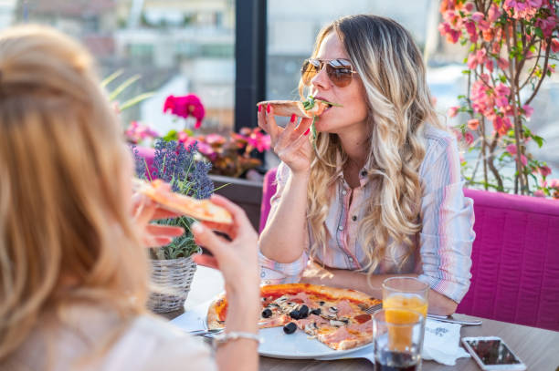 istock Two women at restaurant 1281681303